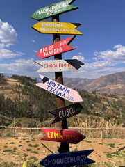 Crossroad signpost showing the way in Andes, Peru