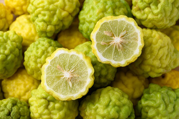 Kaffir lime fruit background, Organic ingredients in Thai cuisne, beauty and cosmetics - obrazy, fototapety, plakaty