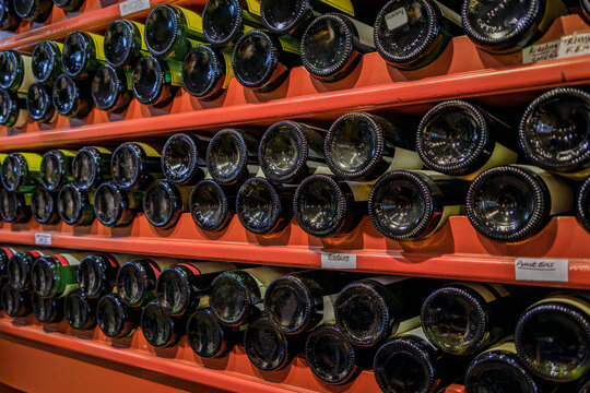 Bottles of traditional Alsatian white wine from local wineries lined up on store shelves in the Carre d'Or, the historic center of Strasbourg, Alsace
