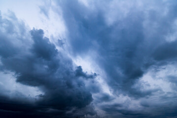 Naklejka na ściany i meble Dark sky with stormy clouds. Dramatic sky rain,Dark clouds before a thunder-storm.