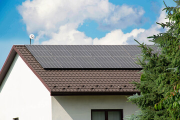 Fototapeta na wymiar Installing a Solar Cell on a Roof.