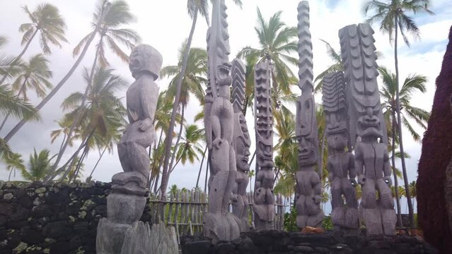 Gimbal wide panning shot of tiki statues at Pu'uhonua O Honaunau National Historical Park in Hawai'i. 4K