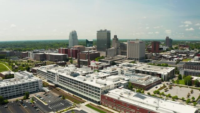 A push drone shot of the Winston-Salem skyline in North Carolina in the summer.