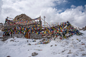 The beautiful views of Colorful Tibetan prayer flags on Khardung La or Khardung Pass