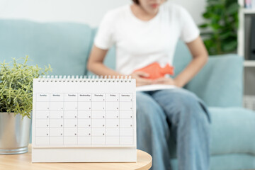 stomach ache. Asian women have abdominal pain, indigestion, gastritis, menstrual cramps,...