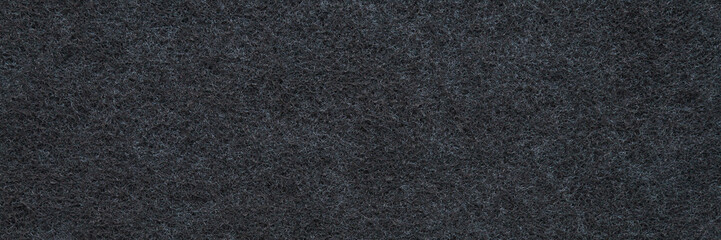 Background of new dark black charcoal filter for kitchen cooker hood. Wide banner. Closeup. Empty place for text. Top down view.