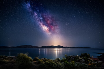 Naklejka premium Milky Way over Hydra island in Greece