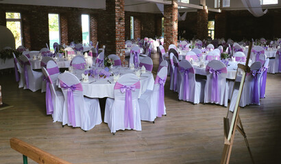 Beautiful wedding table set with purple decorations and lavender