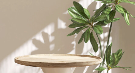 Round natural wooden podium table, green tree in sunlight, shadow on beige brown wall. Luxury...