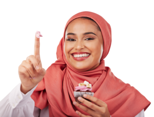 Portrait, cupcake and icing on finger with a muslim woman and isolated on transparent png background. Face, smile and food with a happy young islamic person eating a dessert, candy and sugar snack