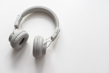 Gray wireless headphones on white background isolated close up, grey headset with big leather ear...