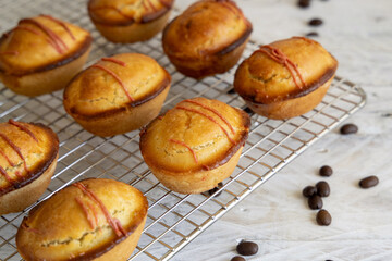 Pasticciotto leccese pastries filled with egg custard cream on a cooling backing rack