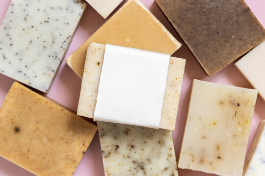 Beige and brown handmade soap bars on light pink top view, soap packaging mockup
