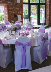 Beautiful wedding table set with purple decorations and lavender