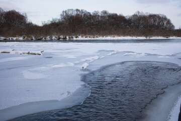 winter is approaching on the river, the ice is freezing