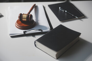 Business and lawyers discussing contract papers with brass scale on desk in office. Law, legal...