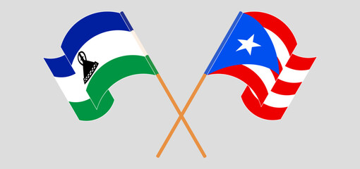 Crossed and waving flags of Lesotho and Puerto Rico