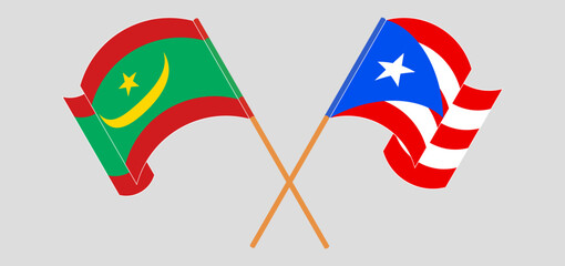 Crossed and waving flags of Mauritania and Puerto Rico