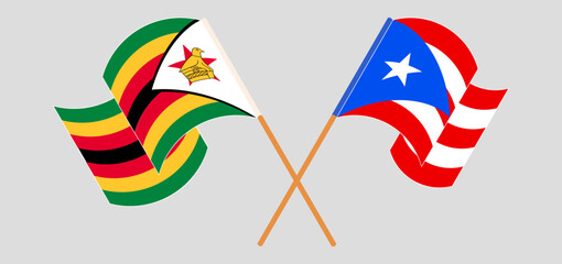 Crossed and waving flags of Zimbabwe and Puerto Rico