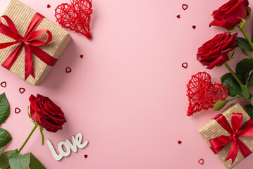 Commemorating Valentine's Day with dear ones: A top-down view of rustic gift parcels, rattan heart decorations, vibrant red roses, text "love", confetti, and pastel pink space for your text or advert