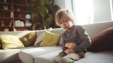 sad little boy holding his stomach, illness, cramps, health, color background, stomach-ache, abdominal, griping, bellyache, tummy-ache, gripes, portrait, ill, child, kid, baby, toddler, son, cry, room