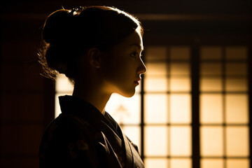 a woman in a kimono looking out a window