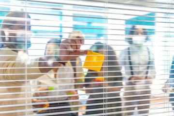 View from the glass of creatives using notes