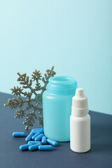 Jars with medicine on a blue background