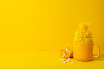 Tablets with a yellow cup and cap