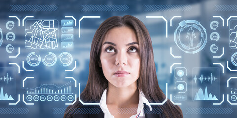 Portrait of attractive thoughtful businesswoman with glowing face recognition hologram on blurry...