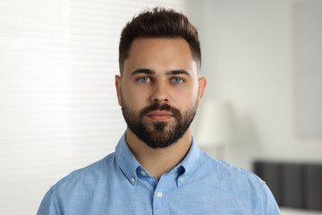 Fototapeta premium Portrait of handsome young man in shirt indoors