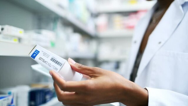 Black woman, hands and pharmacist with tablet, box or medication for inventory inspection on shelve at drugstore. Closeup of female person or doctor with technology and checking stock at pharmacy