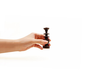 A HAND WITH A CHESS PIECE ON A WHITE BACKGROUND.
