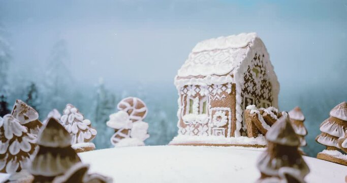 Magic Christmas scene with gingerbread house and trees. Cute elk walking thru the scene. Loop animation