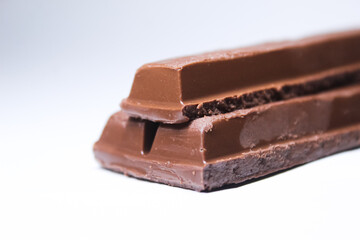 chocolate pieces on white background