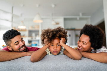Positive parents and teenage offended daughter at home making peace with adolescent child