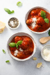 Homemade meatballs with tomato sauce and cheese