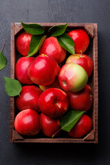 Wooden box with fresh red apples