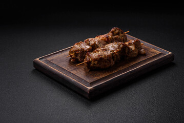 Delicious fried shish kebab of chicken or pork meat with salt, spices and herbs