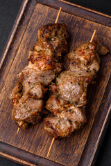 Delicious fried shish kebab of chicken or pork meat with salt, spices and herbs