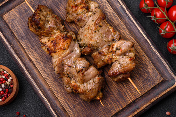 Delicious fried shish kebab of chicken or pork meat with salt, spices and herbs