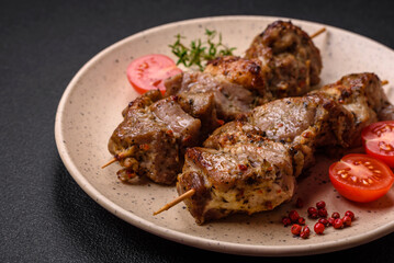 Delicious fried shish kebab of chicken or pork meat with salt, spices and herbs