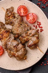 Delicious fried shish kebab of chicken or pork meat with salt, spices and herbs