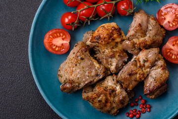 Delicious fried shish kebab of chicken or pork meat with salt, spices and herbs