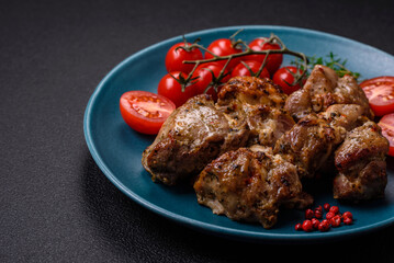 Delicious fried shish kebab of chicken or pork meat with salt, spices and herbs