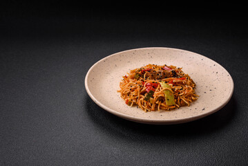 Delicious udon noodles with meat or seafood, vegetables, salt and spices