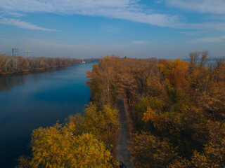 The rowing canal spit on Pobeda in the city of Dnipro from above. River View. Autumn colors. Drone photography. A place for a walk in the city.