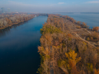 The rowing canal spit on Pobeda in the city of Dnipro from above. River View. Autumn colors. Drone photography. A place for a walk in the city.
