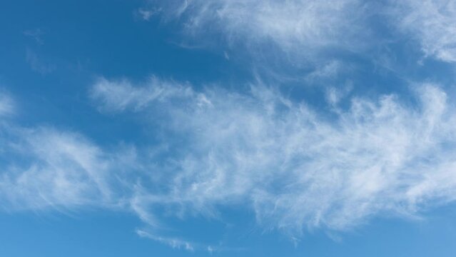 Blue sky white clouds. Puffy fluffy white clouds. Cumulus cloud cloudscape timelapse. Summer blue sky time lapse. Nature weather blue sky. White clouds background.