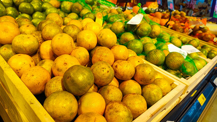  fresh fruits arrange neatly grocery store. Orange, Pomegranate